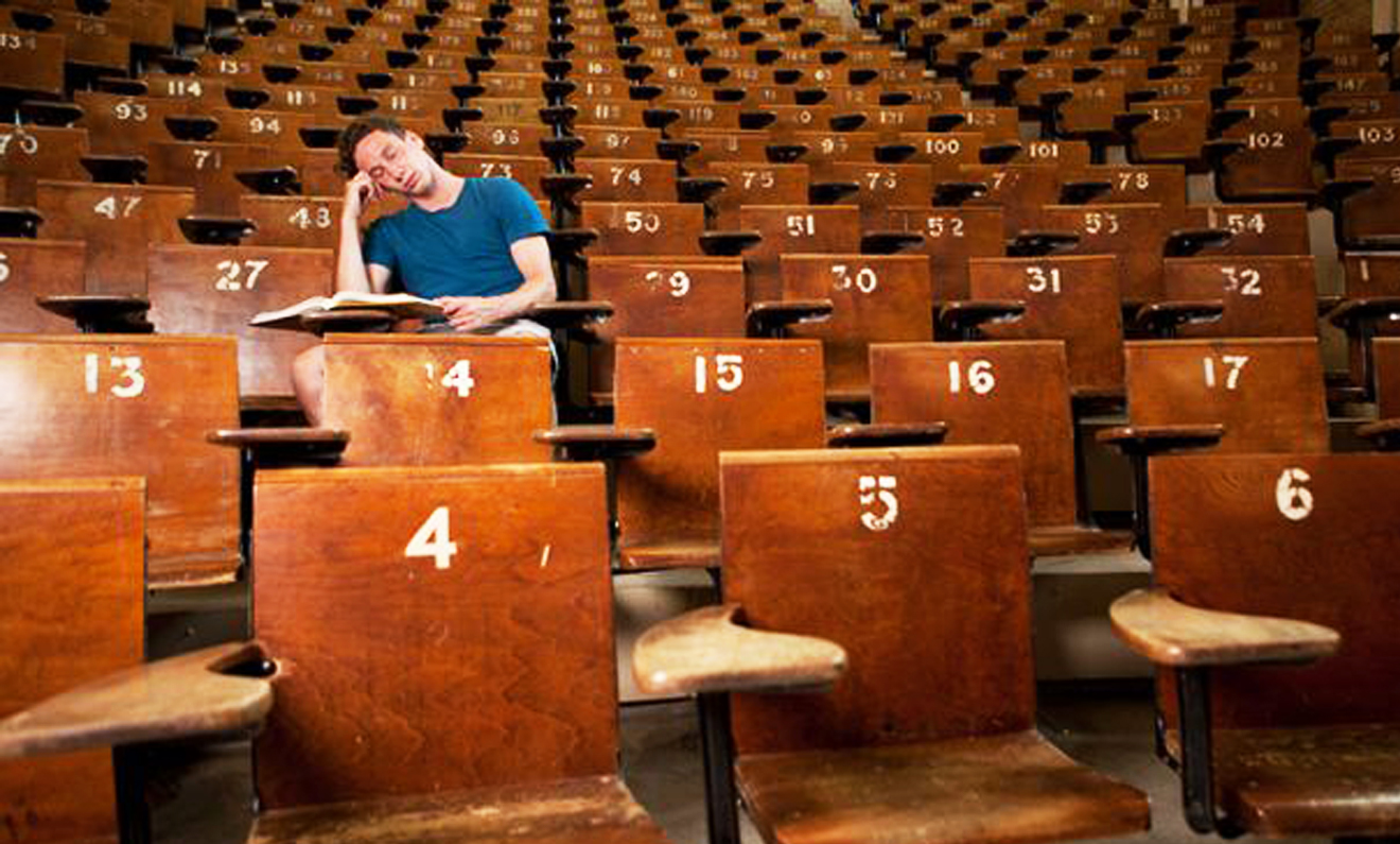 Student in empty lecture Hall